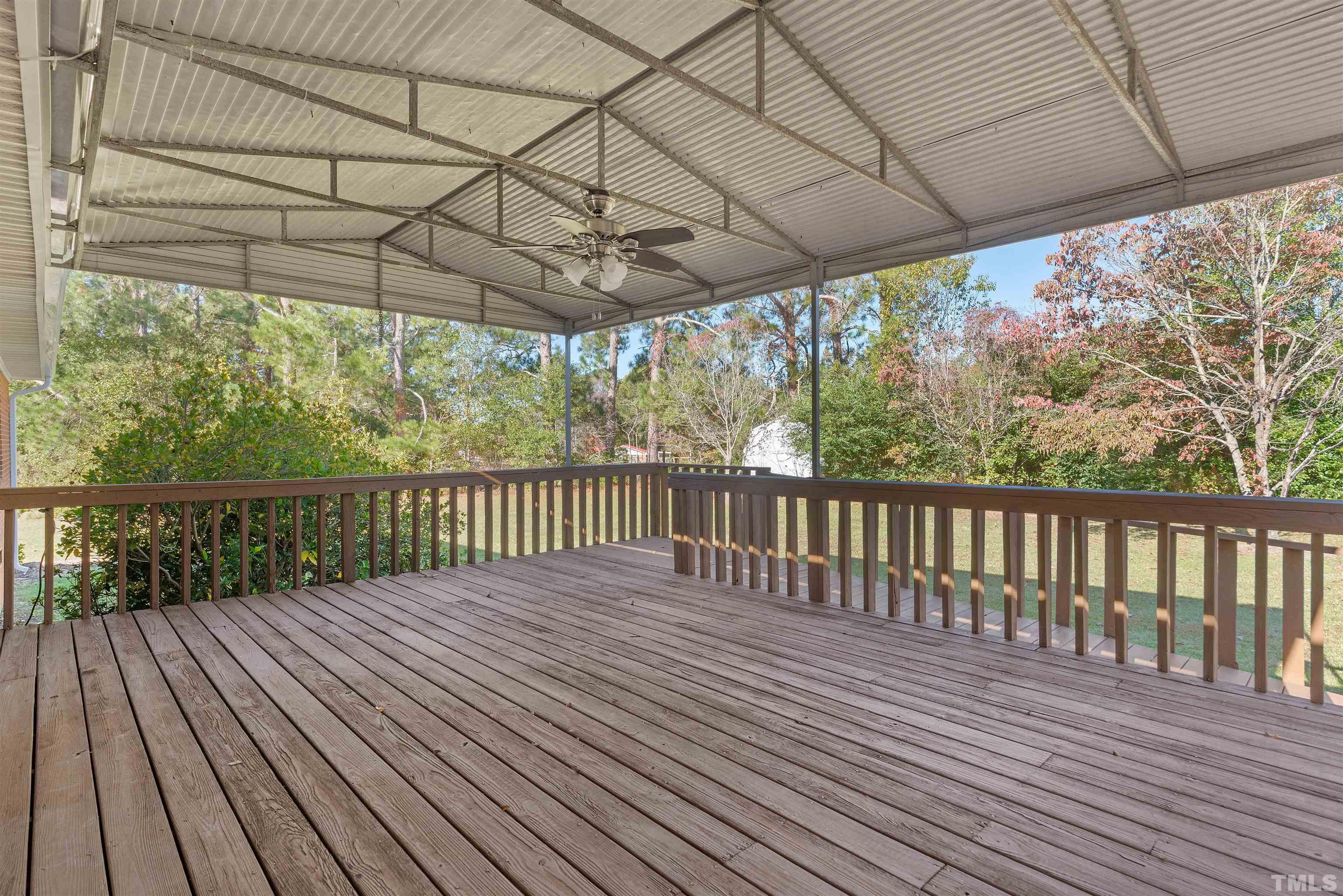 5630 Fairground Road Dunn, NC 28334 - Photo 25 of 33 a view of porch with wooden floor