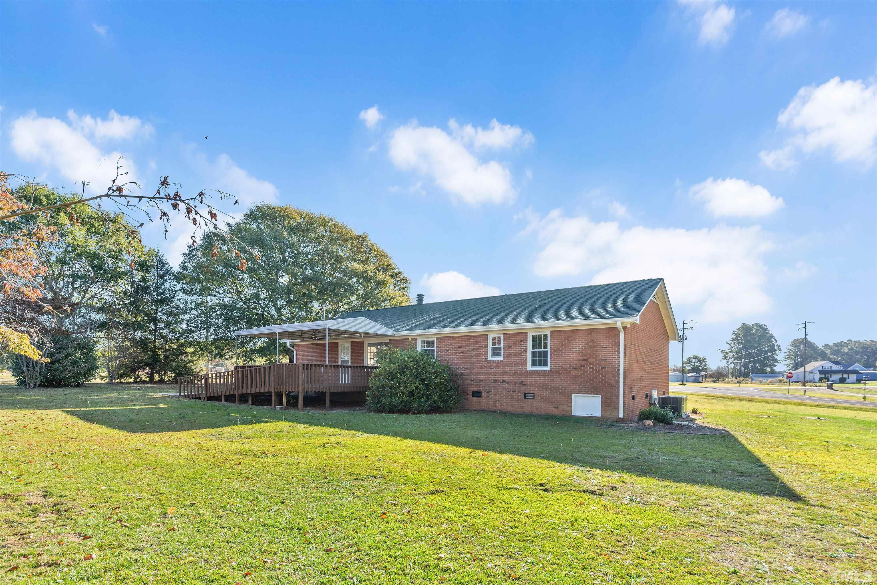 5630 Fairground Road Dunn, NC 28334 - Photo 32 of 33 a view of a house with a swimming pool
