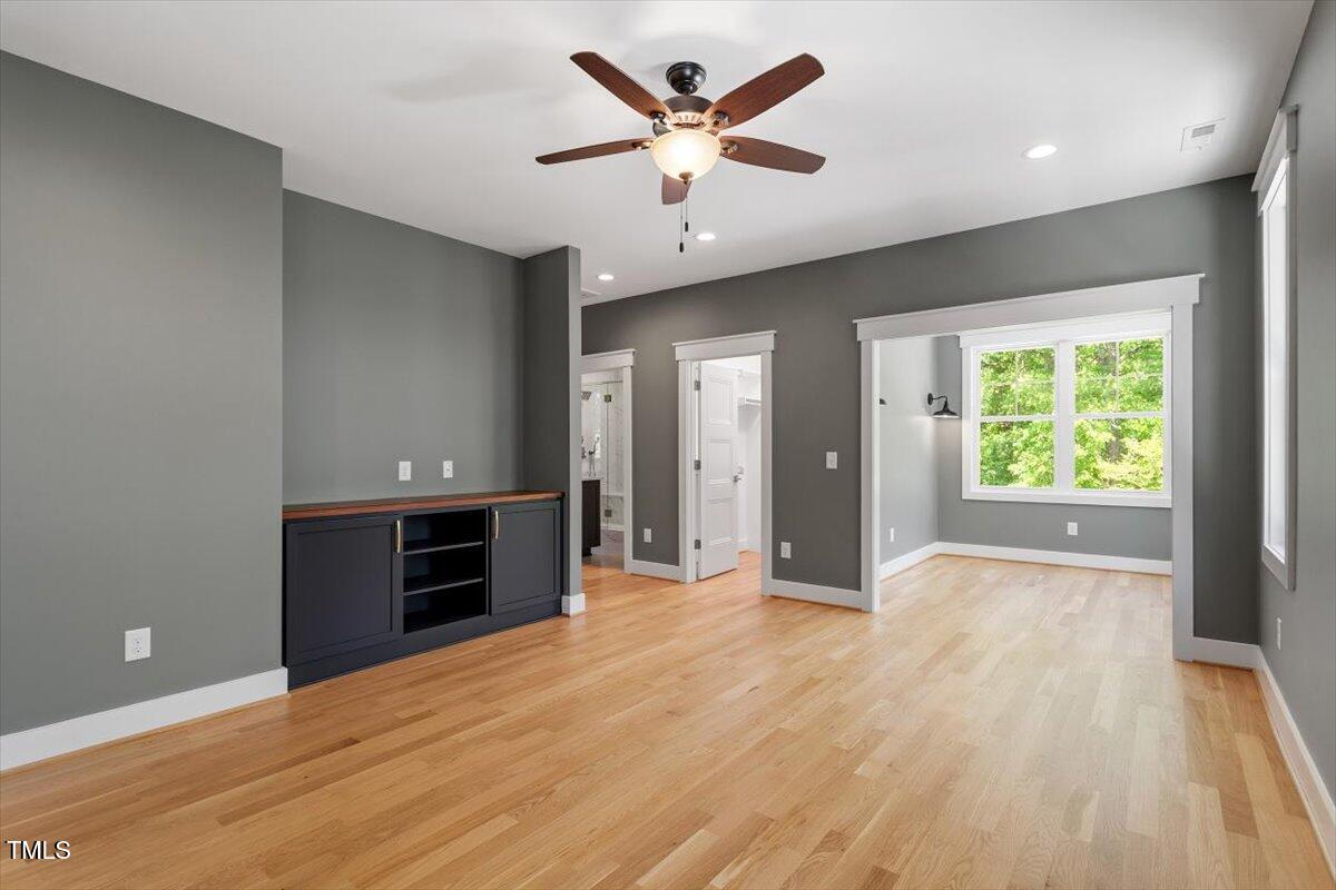 3934 Old Chapel Hill Road Durham, NC 27707 - Photo 27 of 47 wooden floor in an empty room with a window
