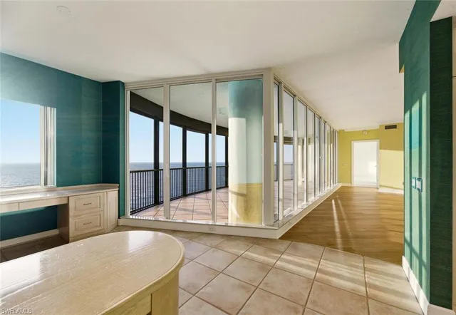 a large kitchen with stainless steel appliances granite countertop a sink and cabinets
