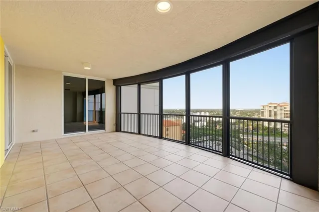 a view of a livingroom with an empty space and a window
