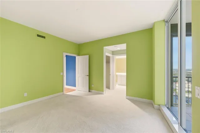 a bathroom with a toilet a sink and a mirror