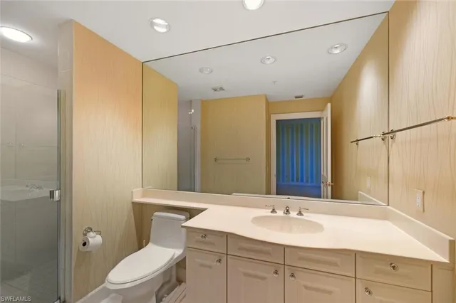 a bathroom with a tub and shower