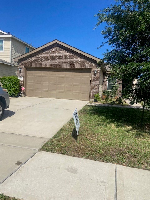 4631 Cullen Brook Road Katy, TX 77449 - Photo 1 of 15 front view of a house with yard