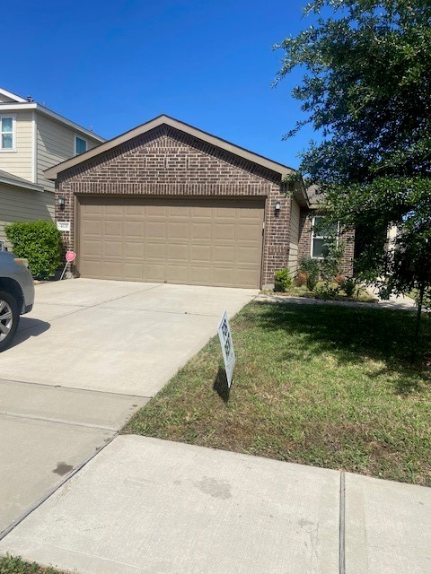 4631 Cullen Brook Road Katy, TX 77449 - Photo 2 of 15 front view of a house with a yard