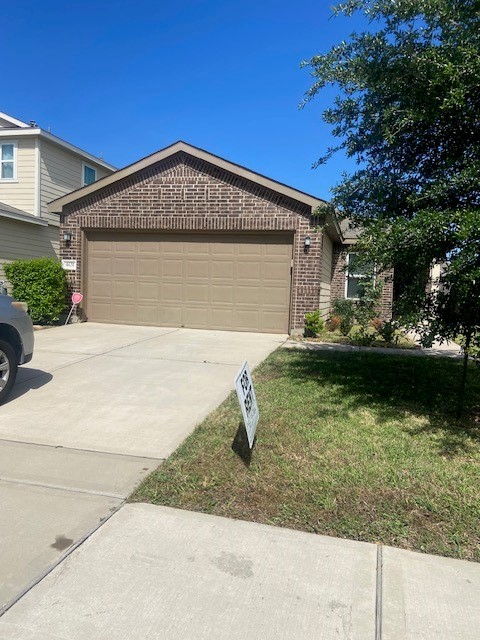 4631 Cullen Brook Road Katy, TX 77449 - Photo 3 of 15 a front view of a house with garden