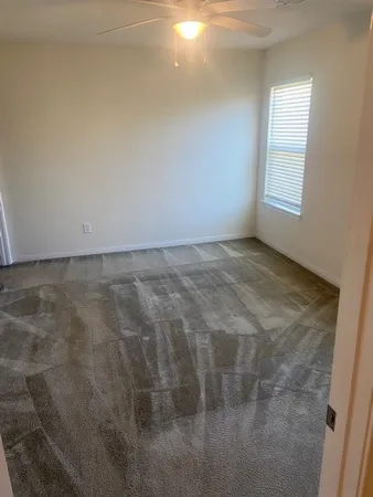 a view of an empty room and window