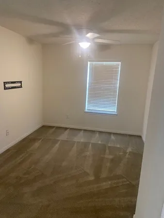 a bathroom with a bathtub shower sink vanity and toilet