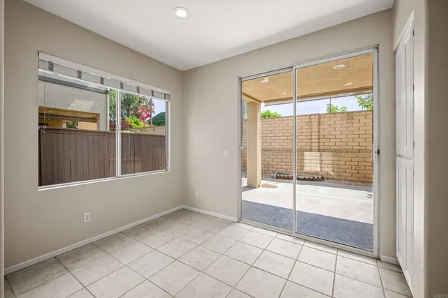 a view of an empty room with glass door