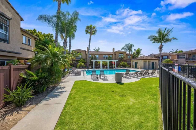 a view of a chairs and table in patio
