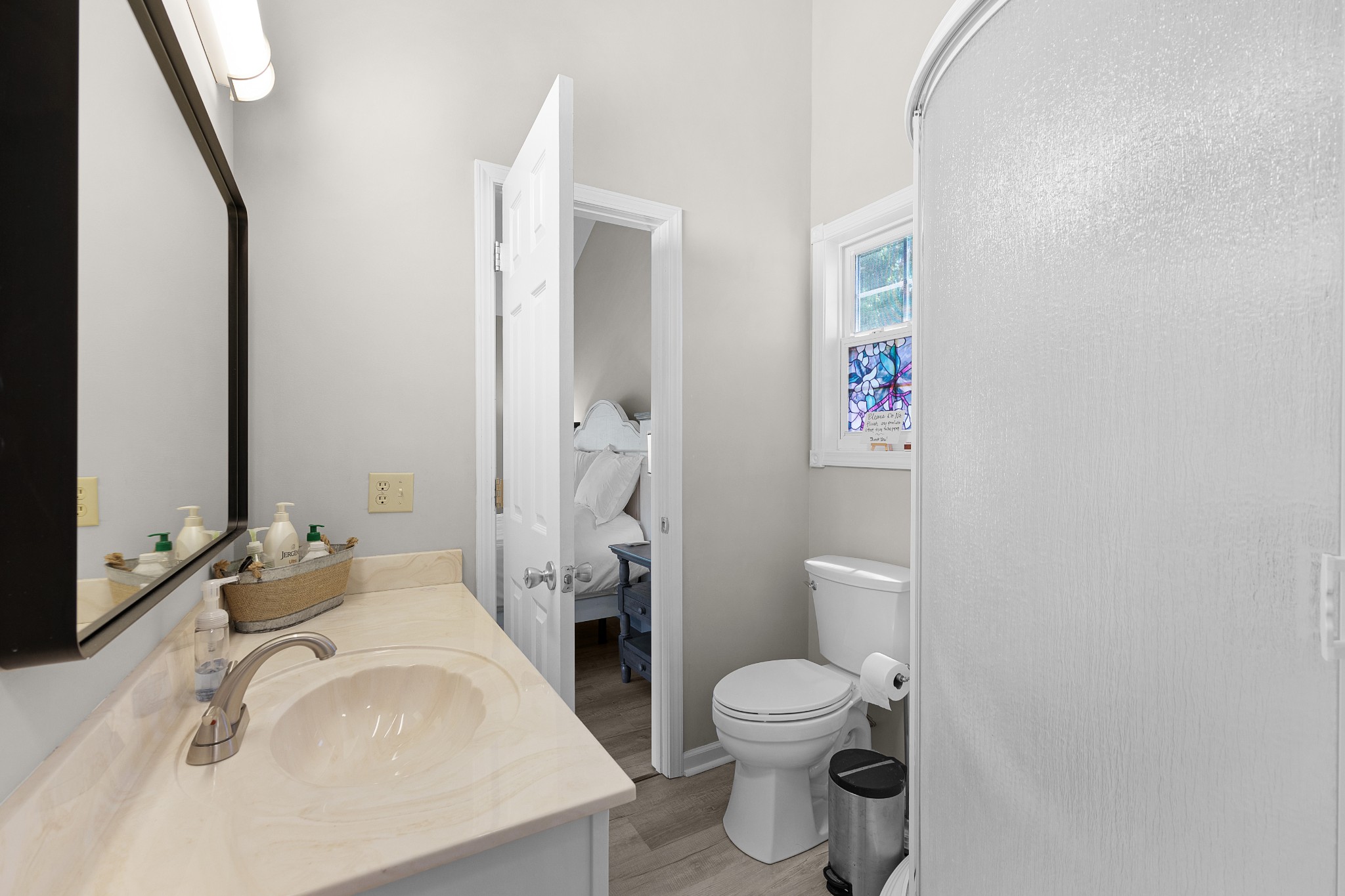 958 Pevahouse Camp Lane Decaturville, TN 38329 - Photo 16 of 32 a bathroom with a sink a toilet and shower