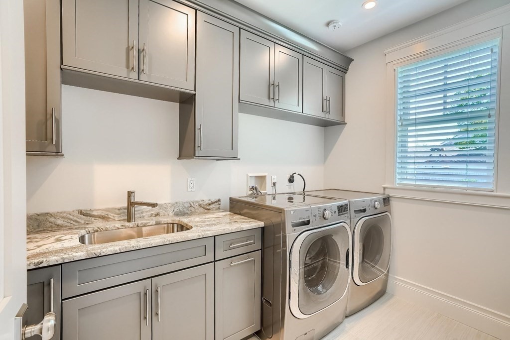 170 Otis Street Hingham, MA 02043 - Photo 20 of 24 a utility room with sink dryer and washer