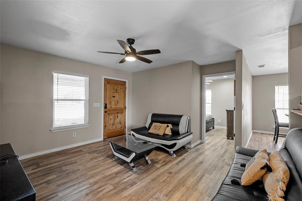 979 Old Mexia Road Waco, TX 76705 - Photo 15 of 40 a living room with furniture a rug and a window