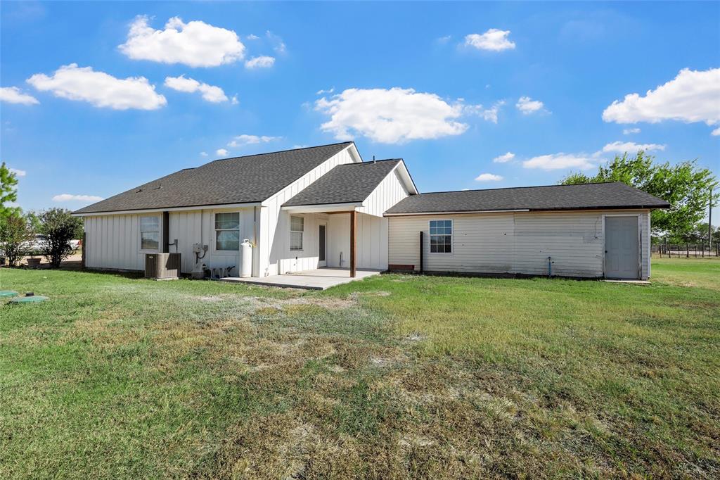 979 Old Mexia Road Waco, TX 76705 - Photo 19 of 40 a front view of a house with a garden