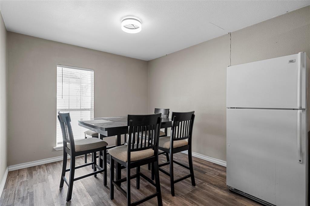 979 Old Mexia Road Waco, TX 76705 - Photo 6 of 40 a view of a dining room with furniture and a refrigerator