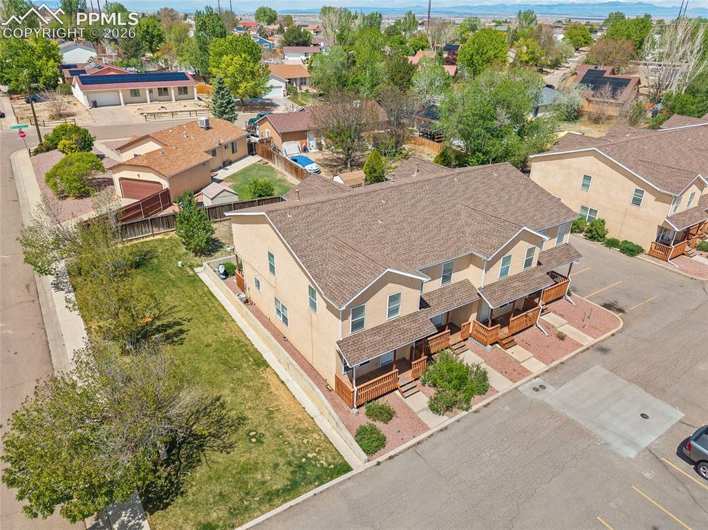 4400 Rawhide Road, Unit 157 Pueblo, CO 81008 - Photo 6 of 36 an aerial view of a house with a garden and trees