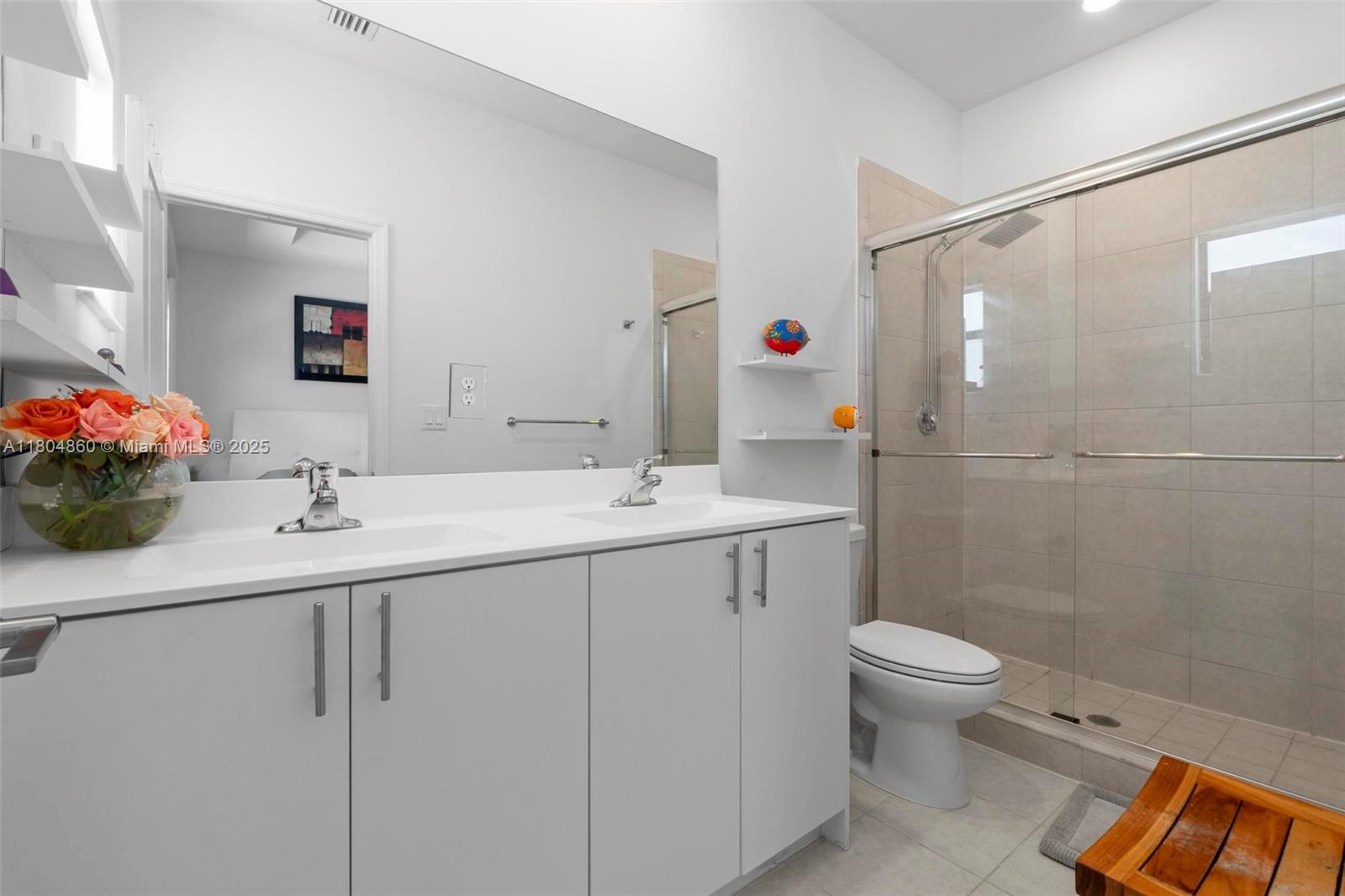 23517 Southwest 127th Place Homestead, FL 33032 - Photo 16 of 28 a bathroom with a sink and a mirror