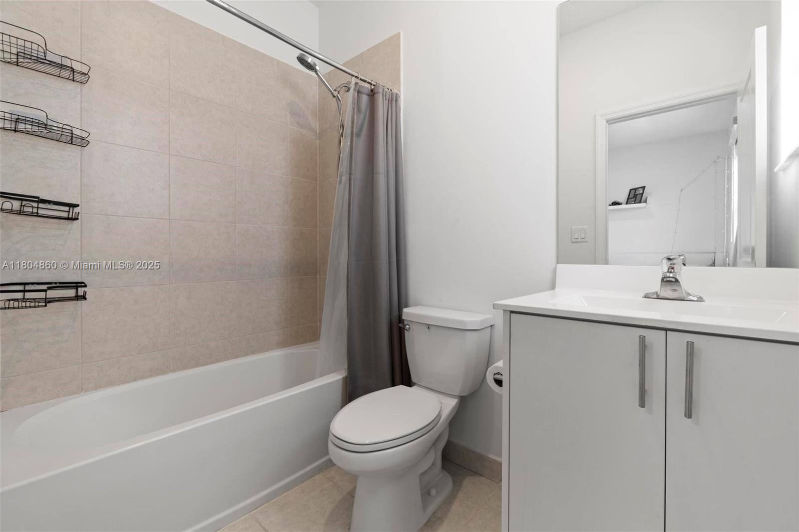 23517 Southwest 127th Place Homestead, FL 33032 - Photo 19 of 28 a bathroom with a sink toilet and shower