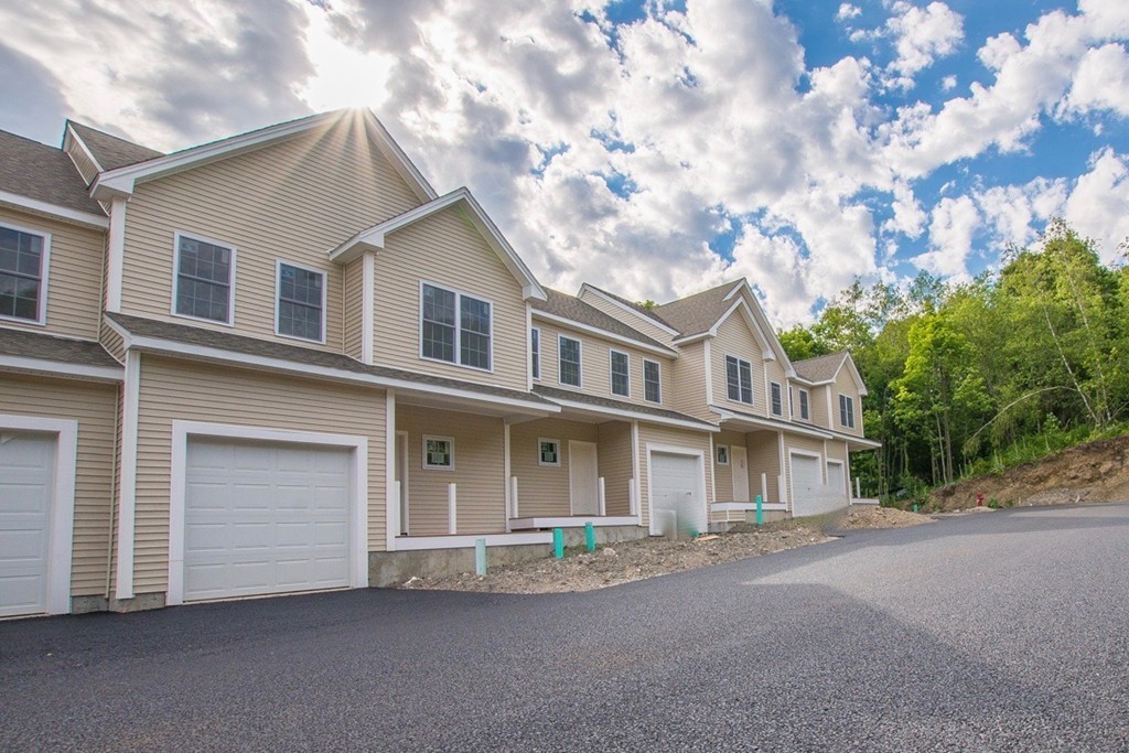 a front view of a house with a garage