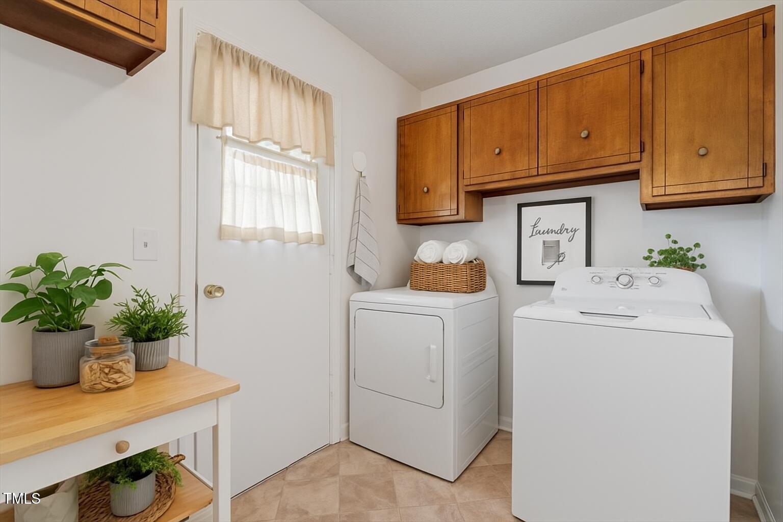 1813 Grady Drive Durham, NC 27712 - Photo 15 of 32 a utility room with cabinets washer and dryer