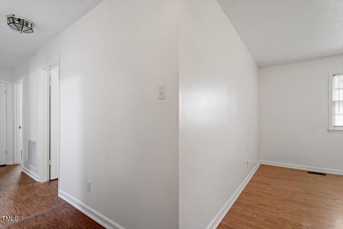 1813 Grady Drive Durham, NC 27712 - Photo 18 of 32 a view of small space with wooden floor