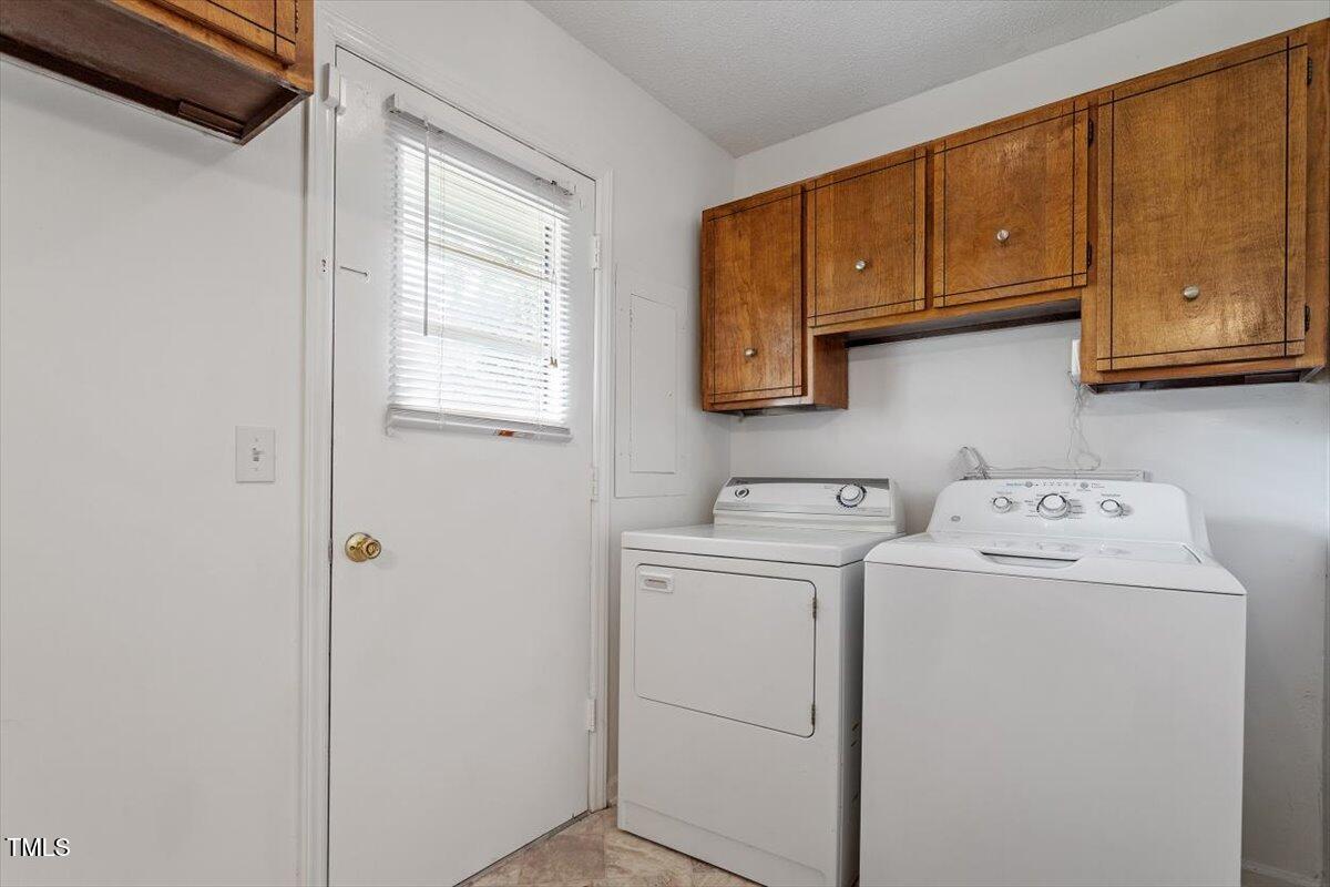 1813 Grady Drive Durham, NC 27712 - Photo 24 of 32 a utility room with dryer and washer