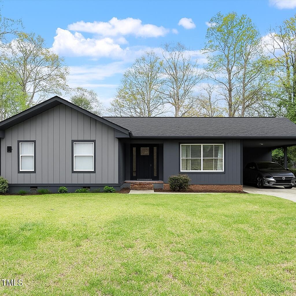 1813 Grady Drive Durham, NC 27712 - Photo 27 of 32 a house view with a sitting space and garden