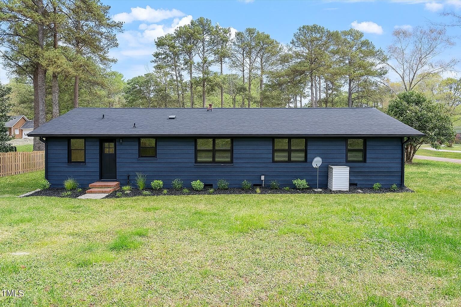 1813 Grady Drive Durham, NC 27712 - Photo 29 of 32 a view of a house with a yard and sitting area