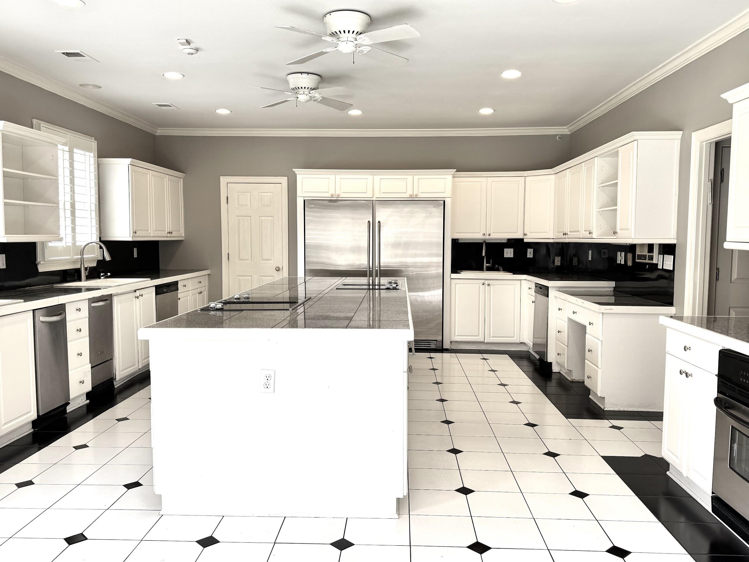 415 South Yates Road Memphis, TN 38120 - Photo 11 of 30 a large white kitchen with a large window