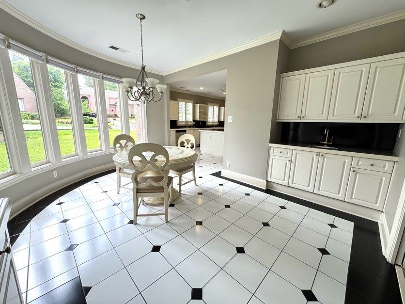 415 South Yates Road Memphis, TN 38120 - Photo 12 of 30 a dining room with furniture and window
