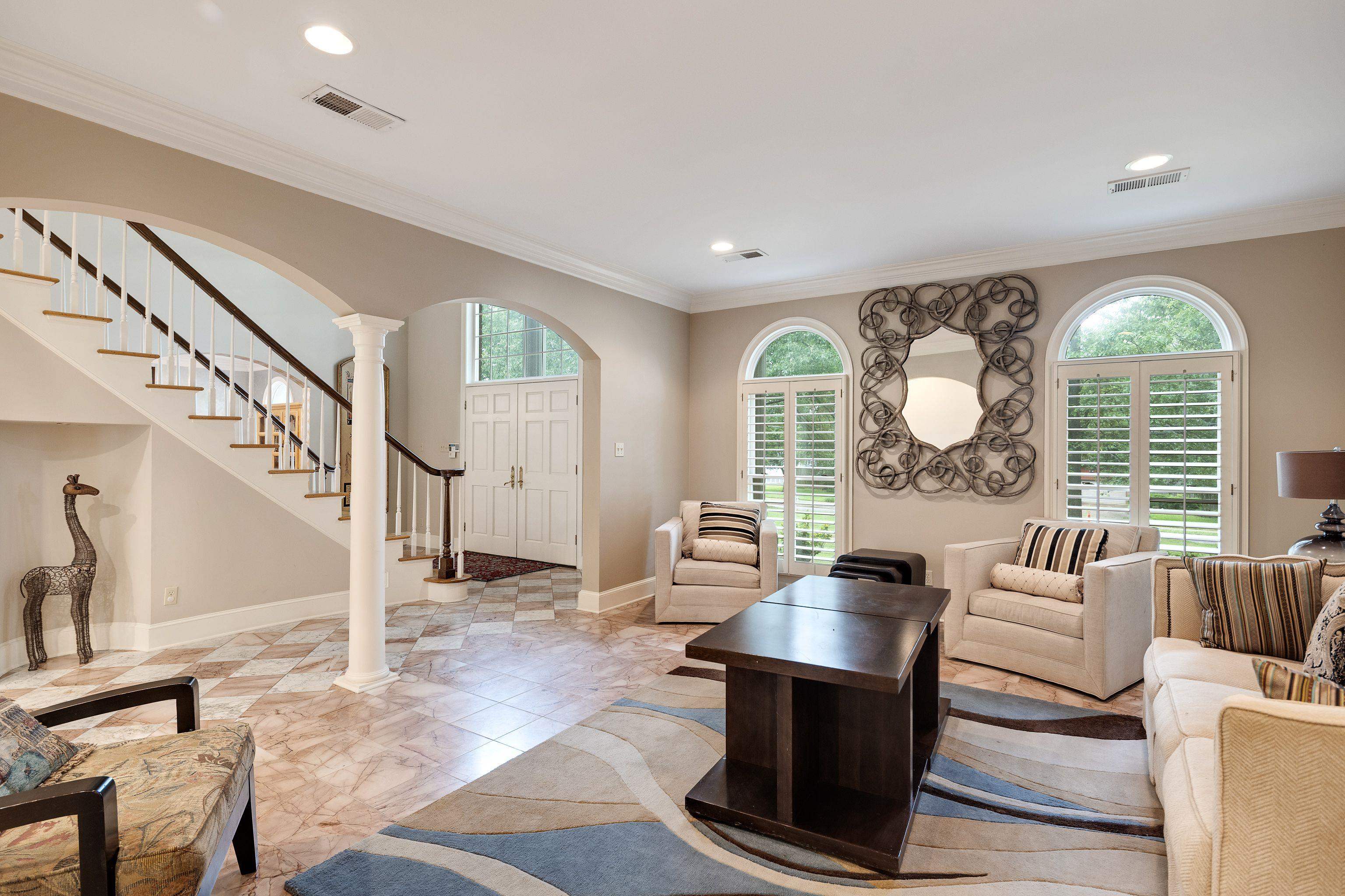 415 South Yates Road Memphis, TN 38120 - Photo 12 of 30 Living area with decorative columns, recessed lighting, ornamental molding, arched walkways, and baseboards