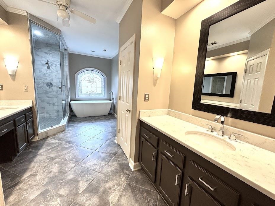 415 South Yates Road Memphis, TN 38120 - Photo 16 of 30 a spacious bathroom with a granite countertop sink mirror and bathtub