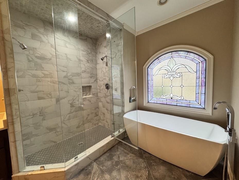 415 South Yates Road Memphis, TN 38120 - Photo 17 of 30 a bathroom with a tub a window and a shower