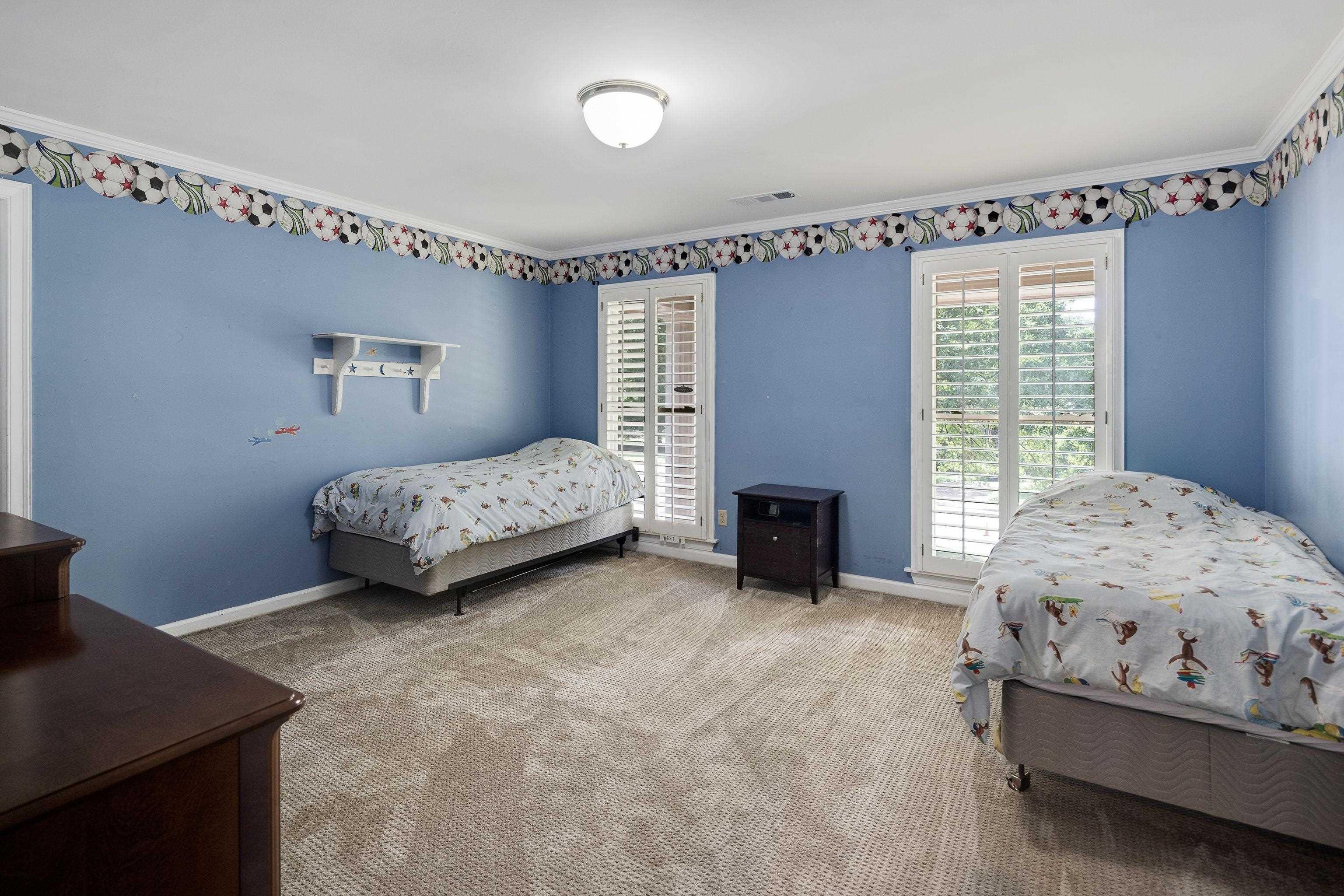 415 South Yates Road Memphis, TN 38120 - Photo 24 of 30 a bedroom with a bed and a fireplace