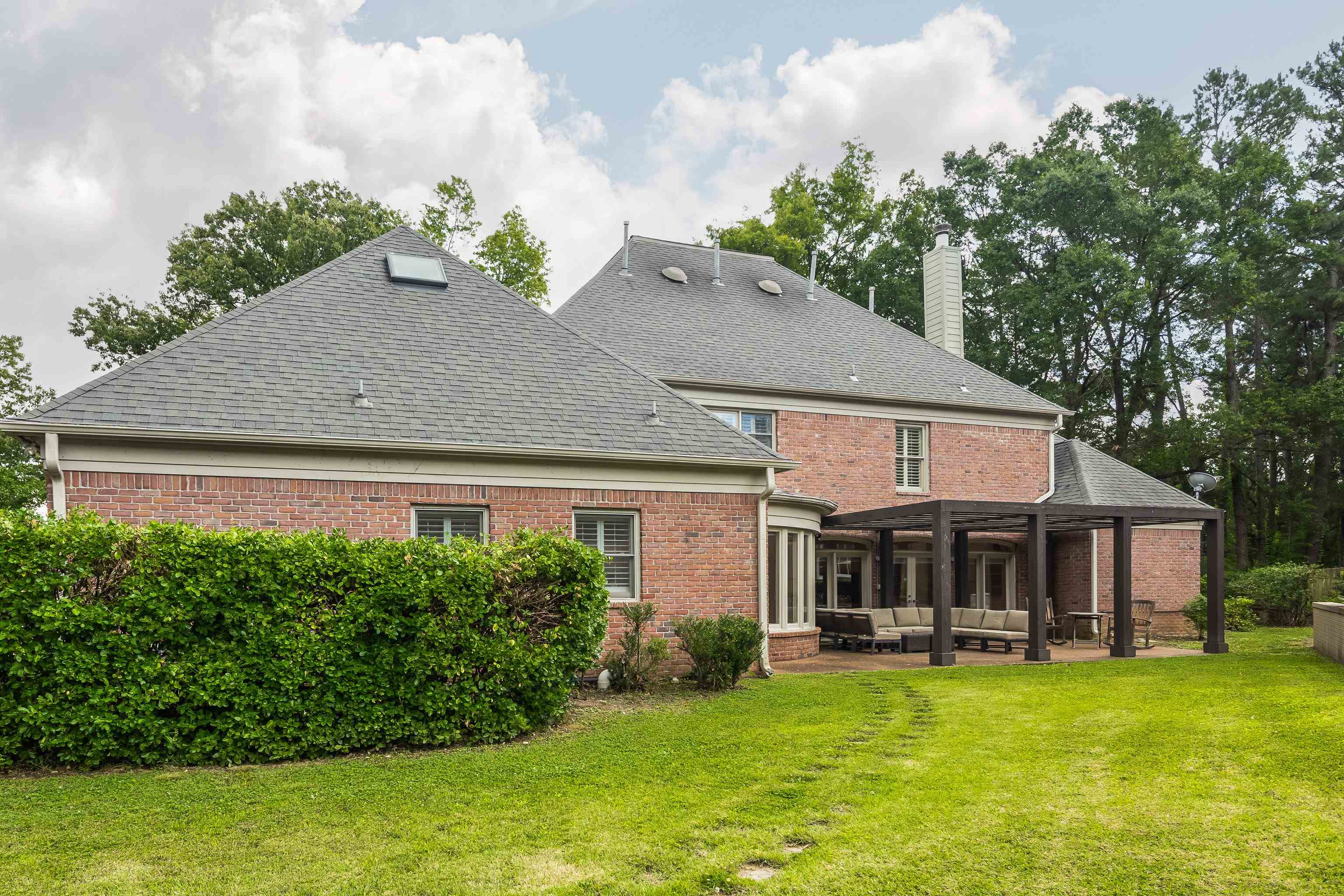 415 South Yates Road Memphis, TN 38120 - Photo 30 of 30 a front view of a house with a garden