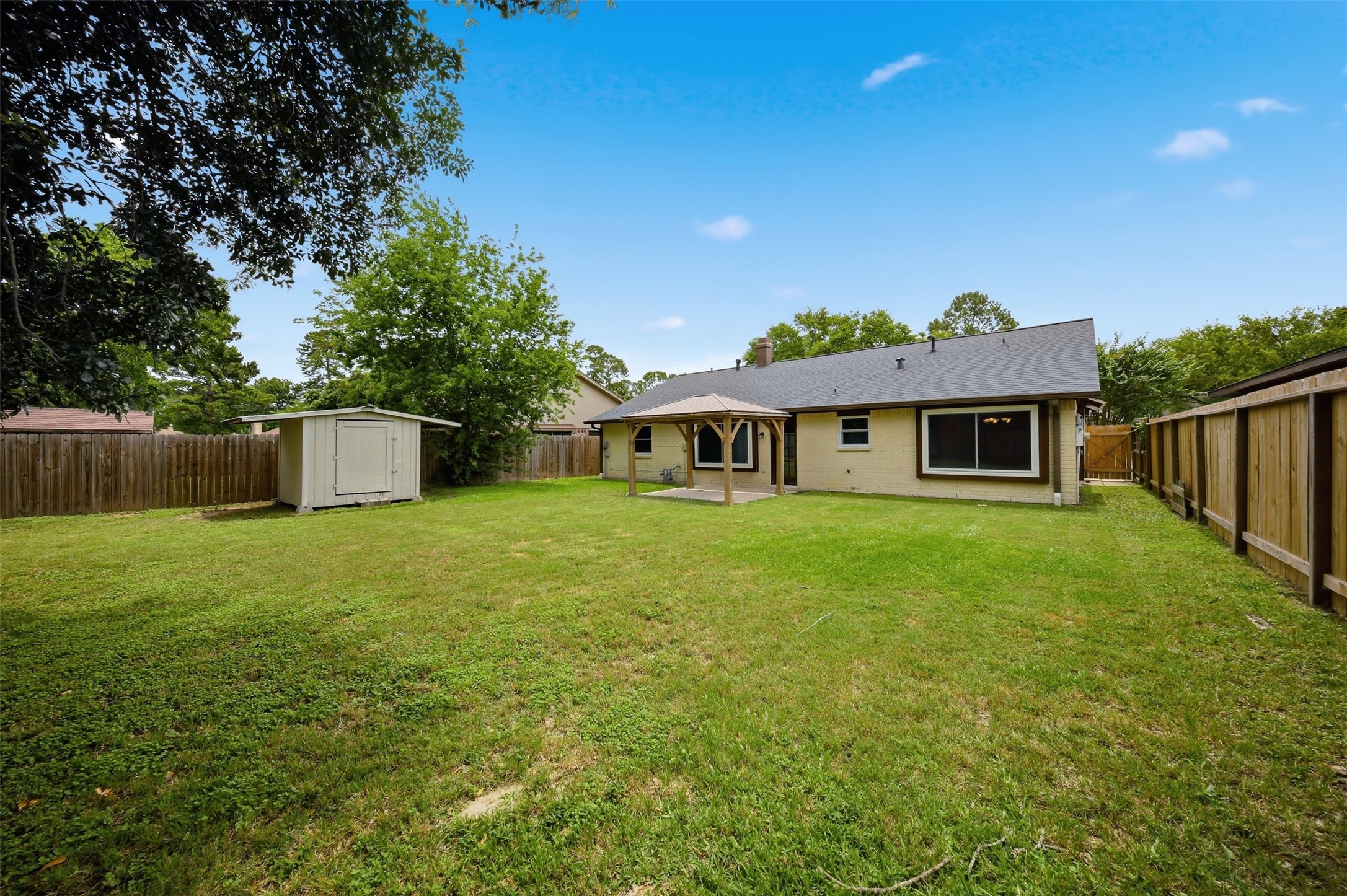 9418 Kilrenny Drive Spring, TX 77379 - Photo 36 of 47 a front view of a house with a garden