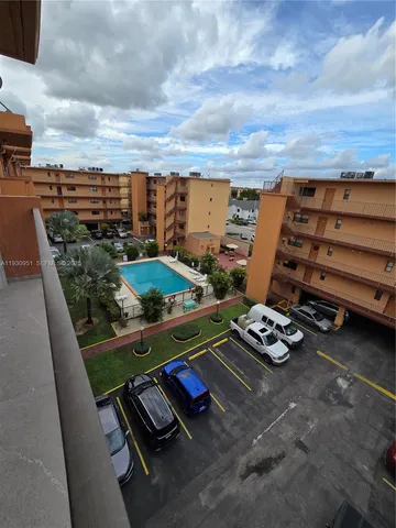 a view of a balcony with chairs