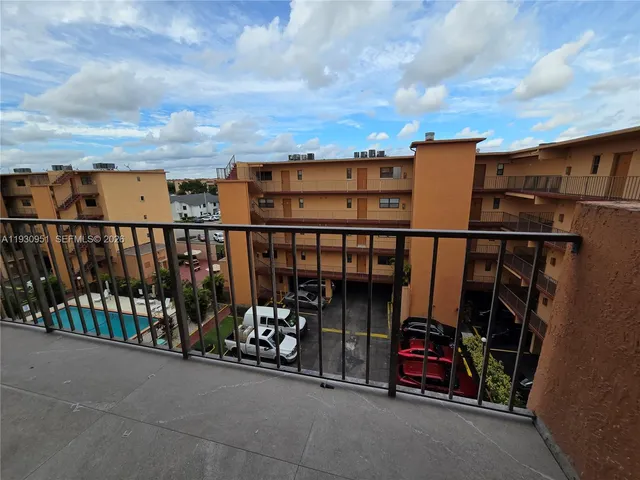 a view of a chairs and table in a terrace