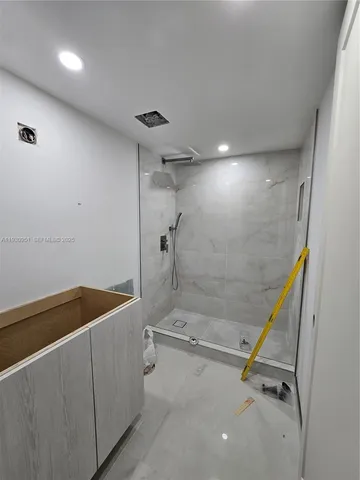 a large kitchen with a large counter top appliances and furniture