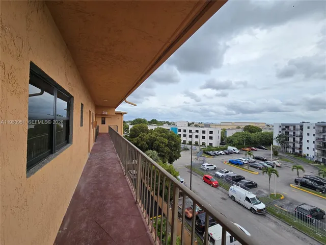 a view of a balcony with chairs