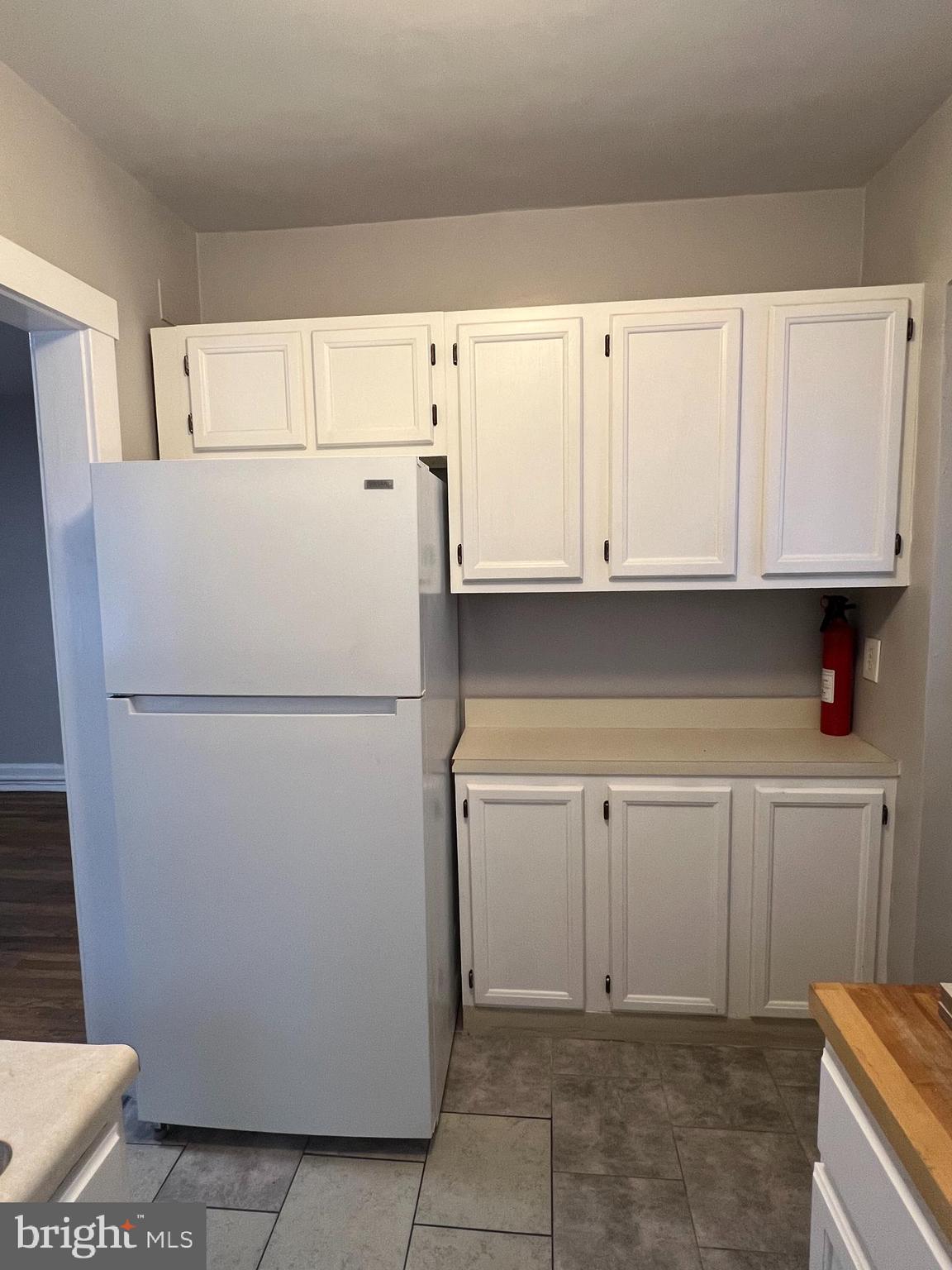 243 Haverford Avenue, Unit 2 Narberth, PA 19072 - Photo 10 of 10 a white refrigerator freezer sitting inside of a kitchen