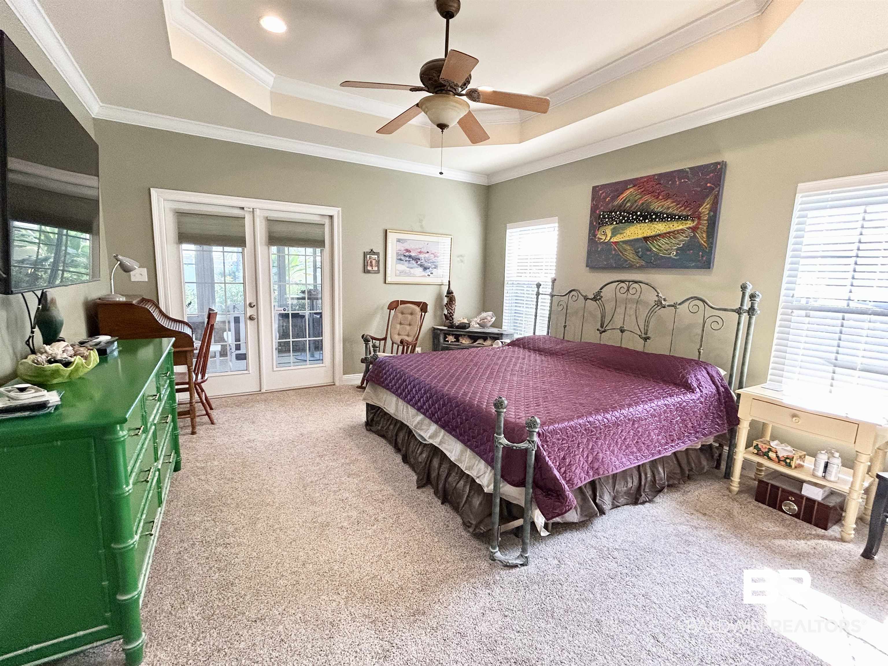 177 Mark Twain Loop Foley, AL 36535 - Photo 15 of 47 Spacious Primary Bedroom with Doors to Sunroom.