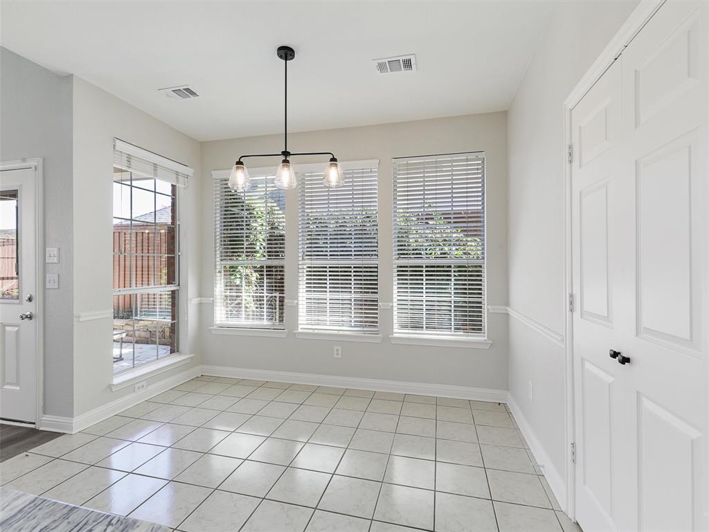 7612 Pendleton Street Dallas, TX 75252 - Photo 19 of 38 a view of an empty room with windows