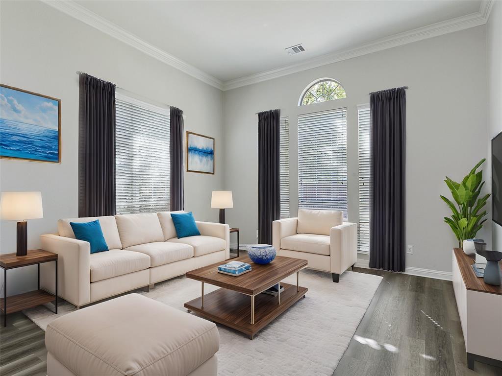 7612 Pendleton Street Dallas, TX 75252 - Photo 2 of 38 a living room with furniture a chandelier and a window