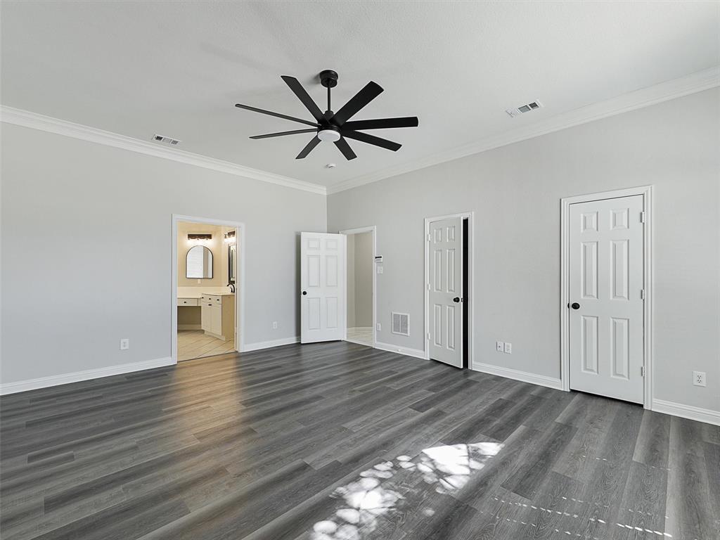 7612 Pendleton Street Dallas, TX 75252 - Photo 21 of 38 a view of empty room with wooden floor and window