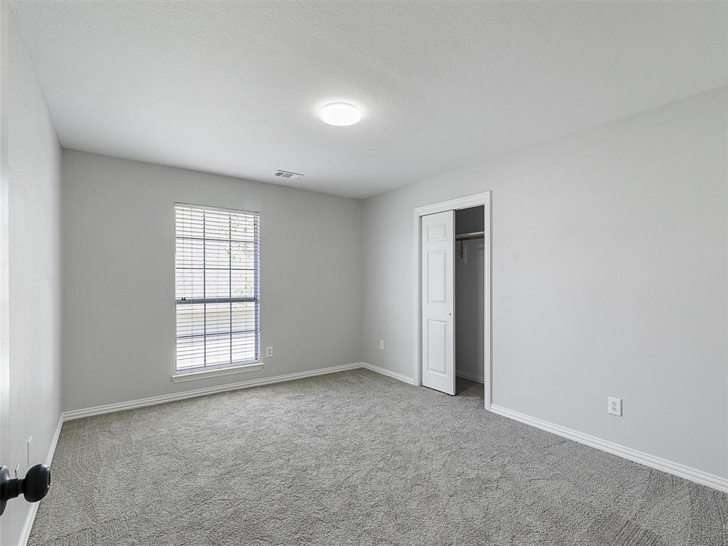 7612 Pendleton Street Dallas, TX 75252 - Photo 28 of 38 an empty room with windows