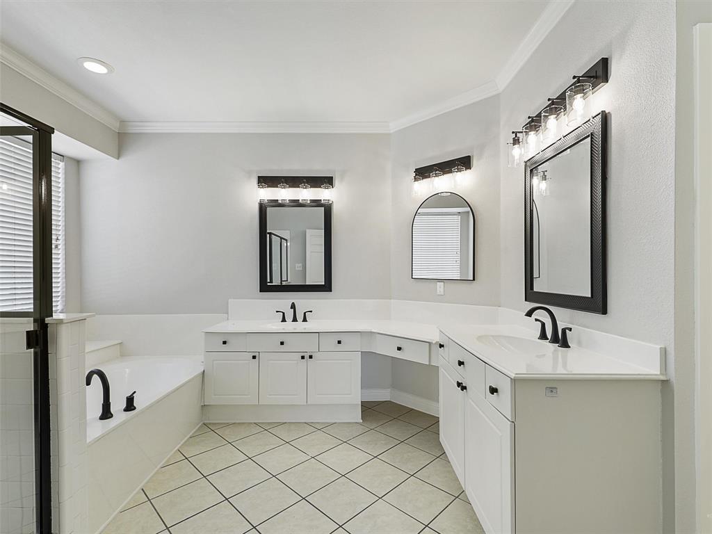 7612 Pendleton Street Dallas, TX 75252 - Photo 7 of 38 a spacious bathroom with a double vanity sink mirror and