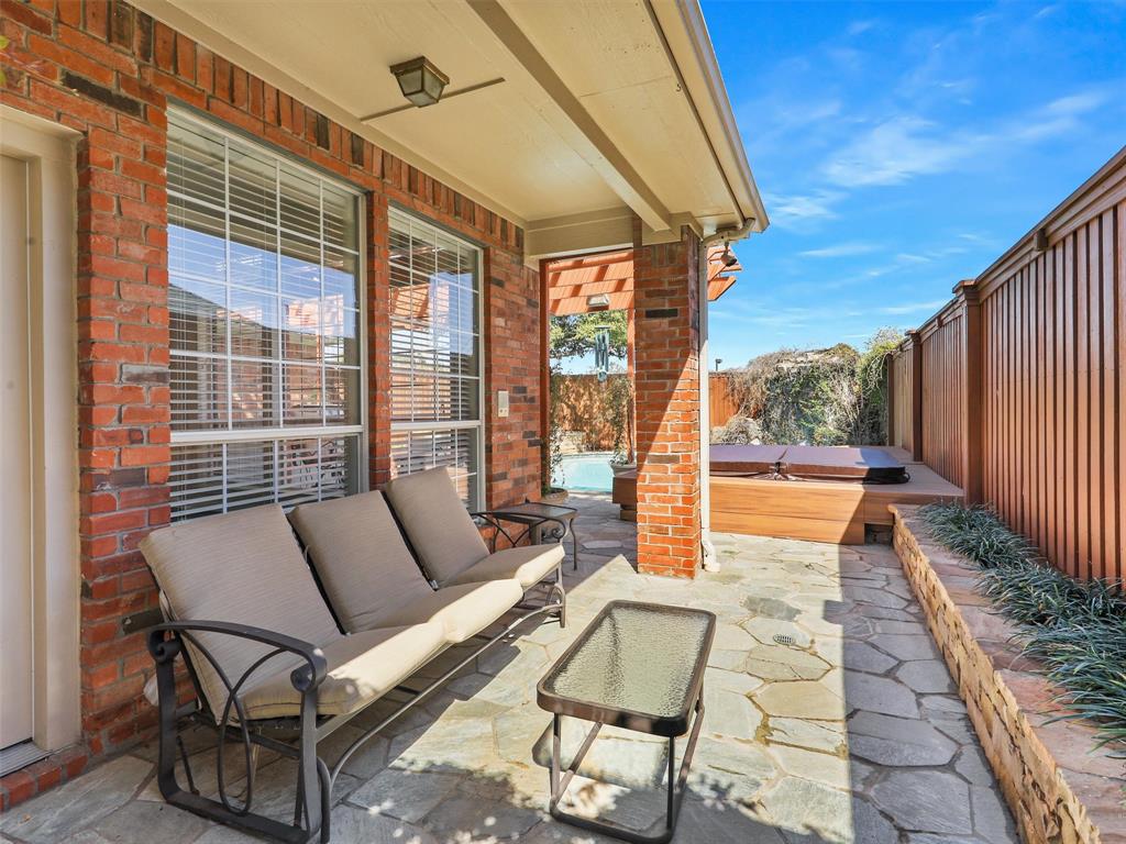 7612 Pendleton Street Dallas, TX 75252 - Photo 9 of 38 a view of a patio with couches table and chairs and potted plants