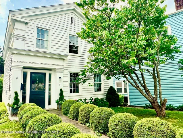 a view of a house with a yard and plants