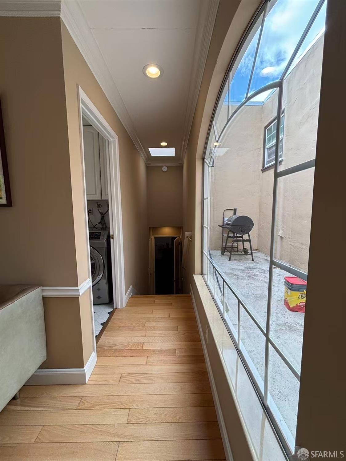 450 Laurel Avenue Millbrae, CA 94030 - Photo 22 of 27 a view of a hallway with wooden floor and furniture
